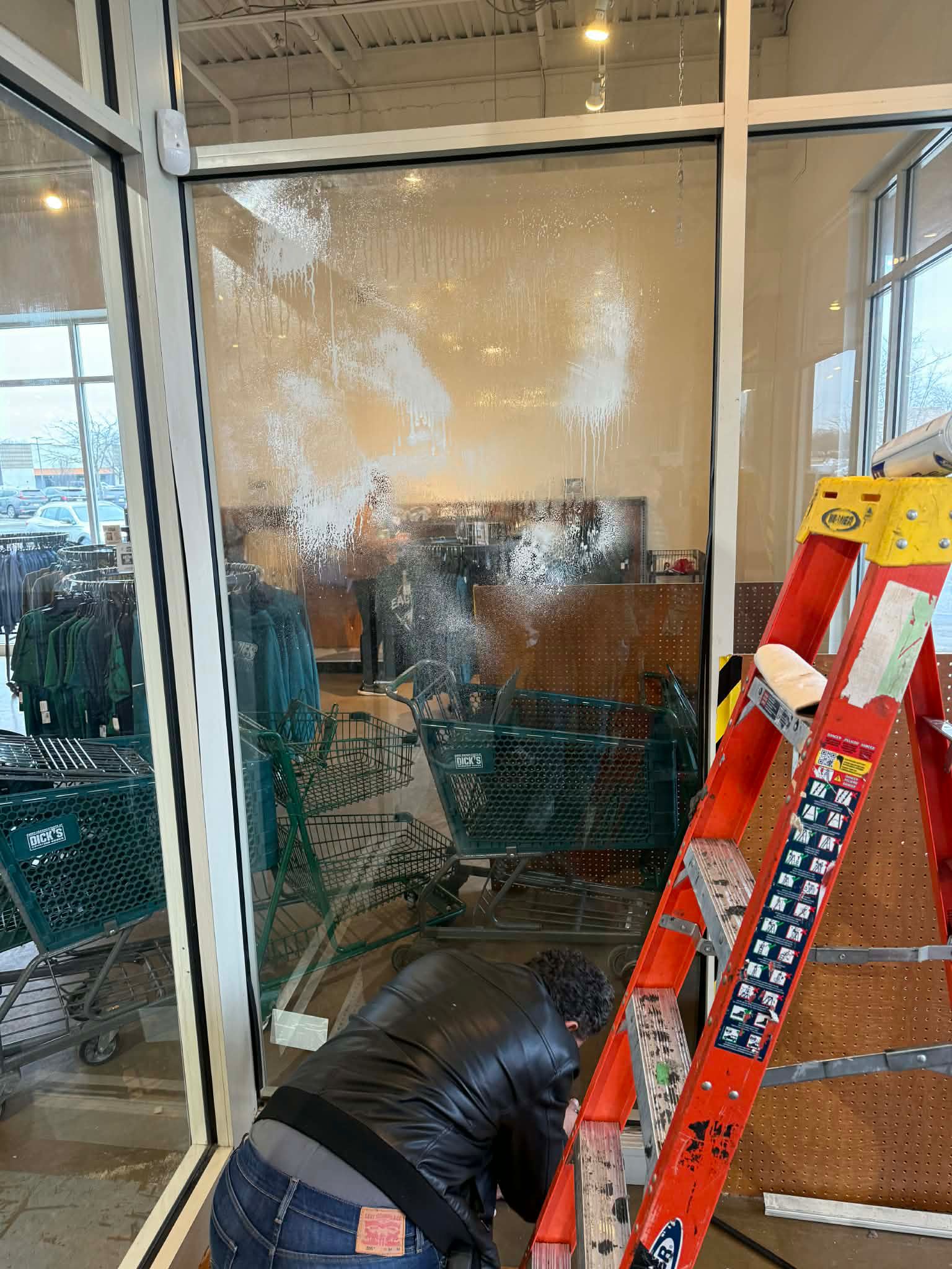 Shower door hardware hinges and glass panel detail.