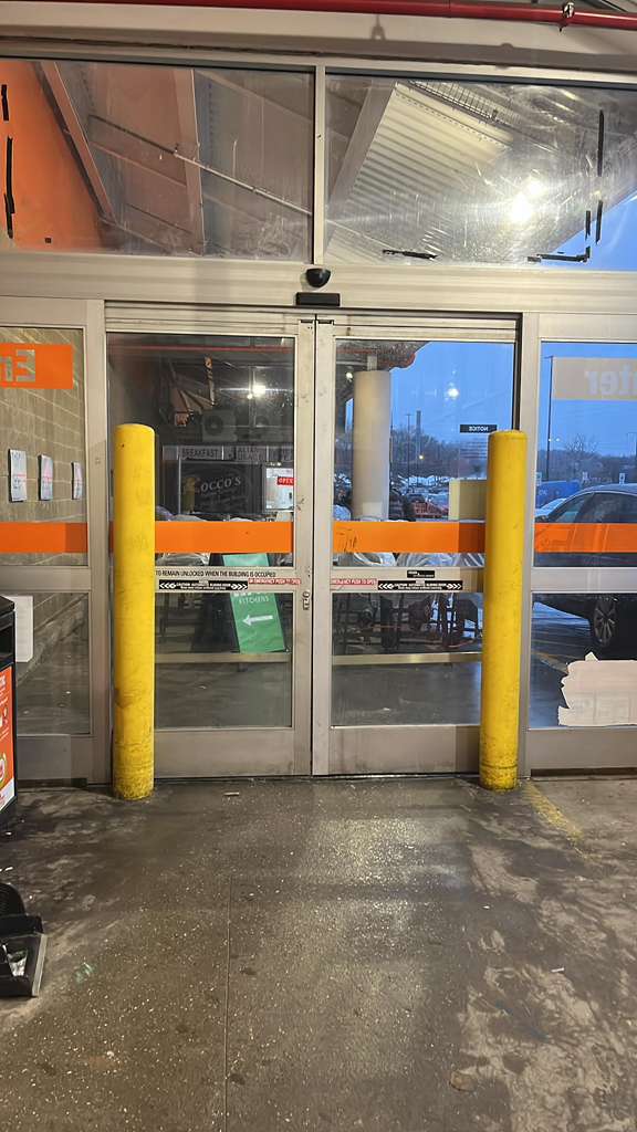 Storefront transom damage needing secure or replace.